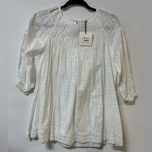 White cotton blouse.